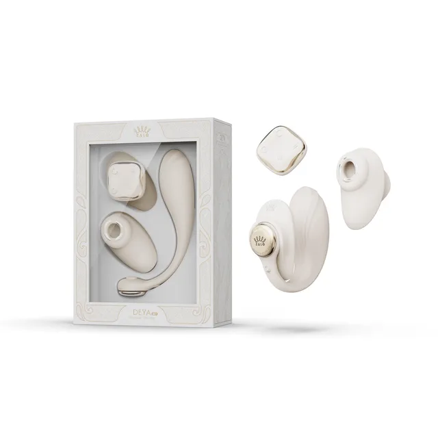 Zalo Aurora Deya Ivory White wearable vibrator set beside the windowed retail box with remote and body separated