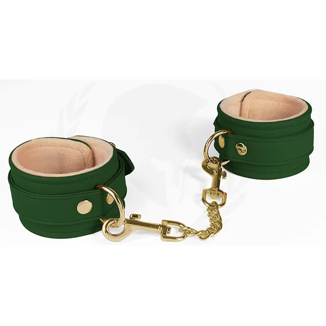 Green plush-lined Spartacus wrist cuffs with gold connecting chain