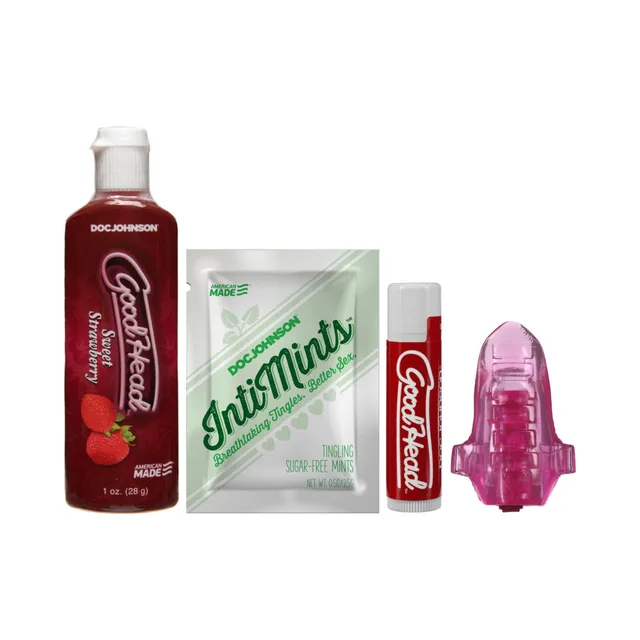 GoodHead kit contents with strawberry liquid, packet, lip balm, and pink accessory