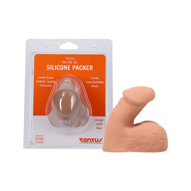 honey-tan Tantus On The Go packer beside its clear orange-label clamshell