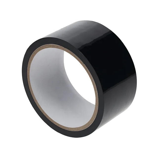 Angled view of glossy black Ouch PVC tape roll with white core