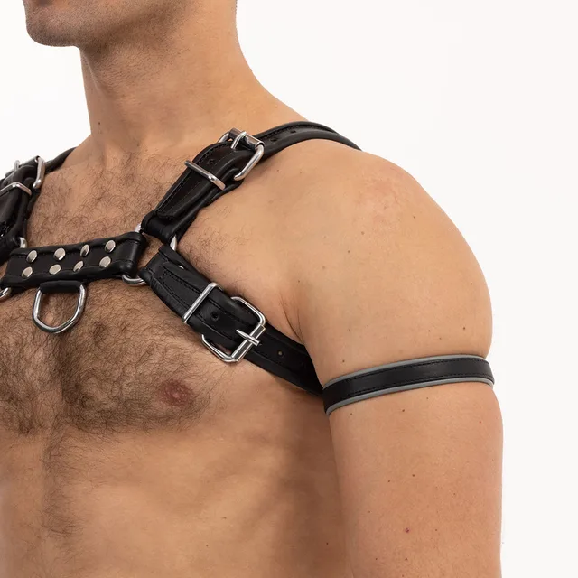 Grey Prowler RED leather bicep band worn on upper arm with chest harness