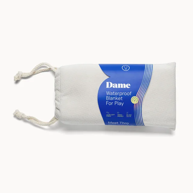 Dame Thro Oat waterproof blanket in drawstring pouch