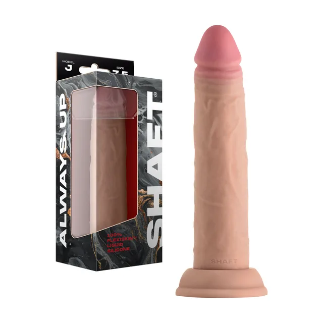 Shaft Model J Pine 7.5-inch dildo beside its retail box