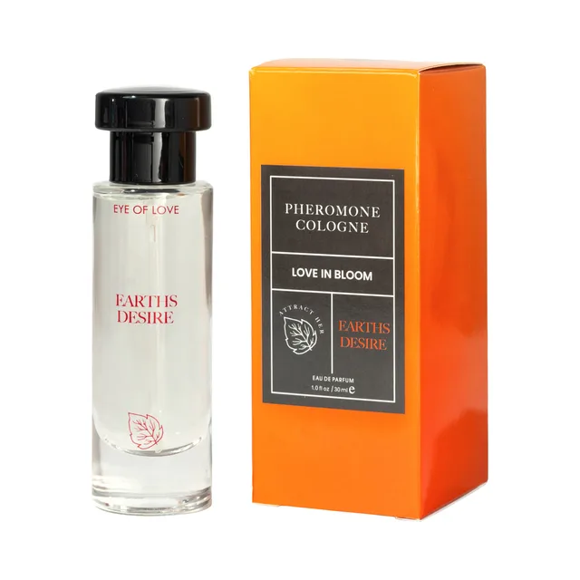 Earth’s Desire parfum bottle beside its tall orange Eye of Love Bloom box