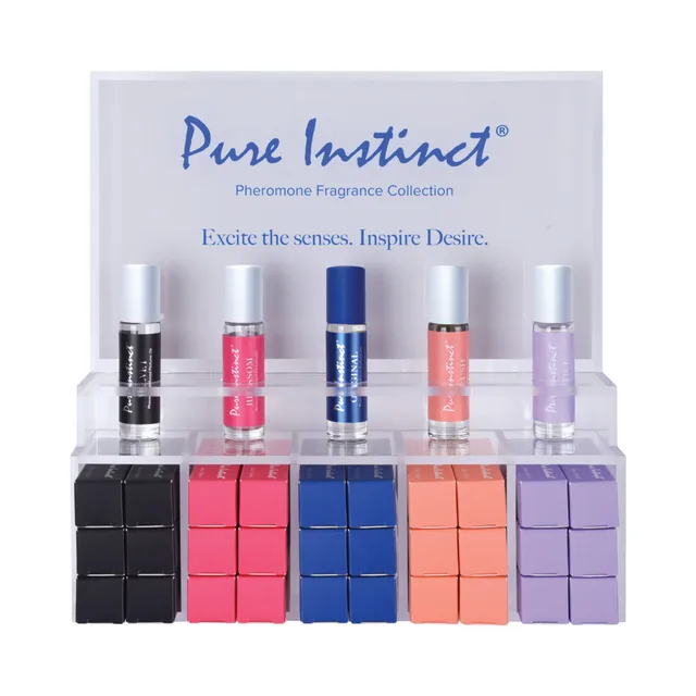 Pure Instinct perfume oil display with five roll-on variants above color-matched boxes