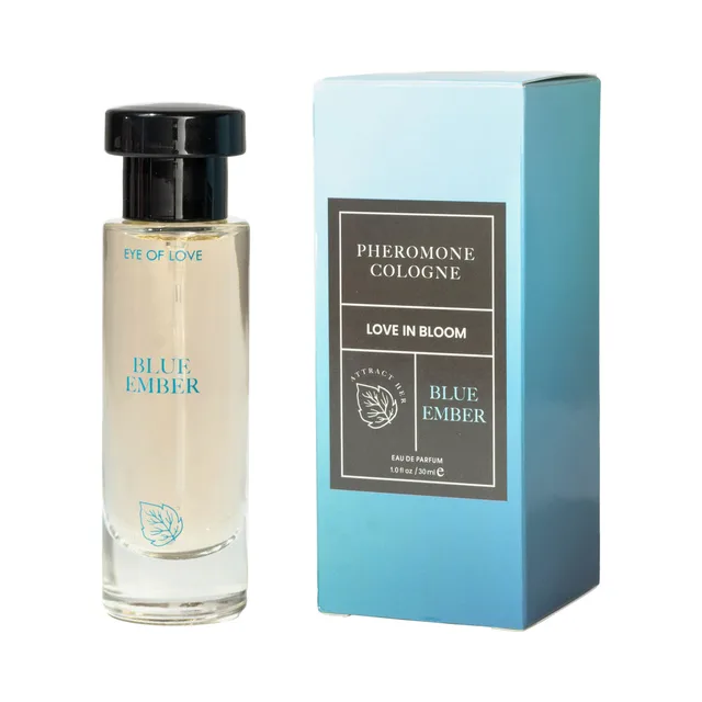 Blue Ember parfum bottle beside its tall blue Eye of Love Bloom retail box