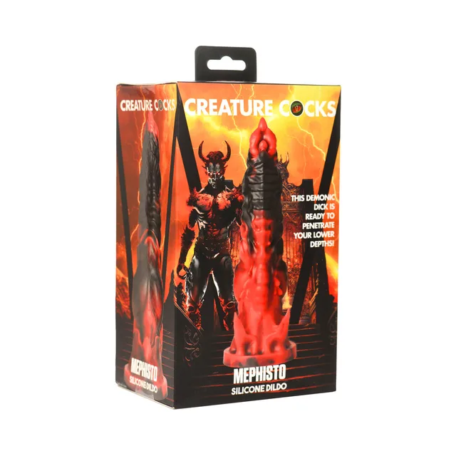 Creature Cocks Mephisto red-and-black flame dildo pictured in orange demon-themed retail box