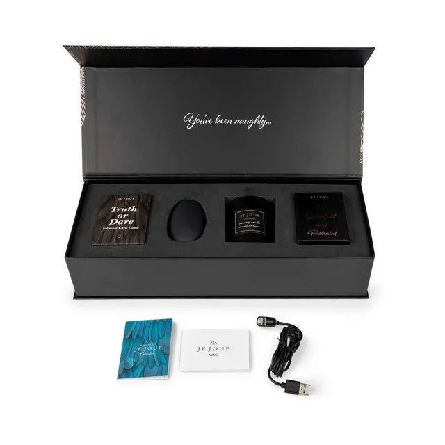 Open Je Joue gift set with vibrator candle cards and satin pieces