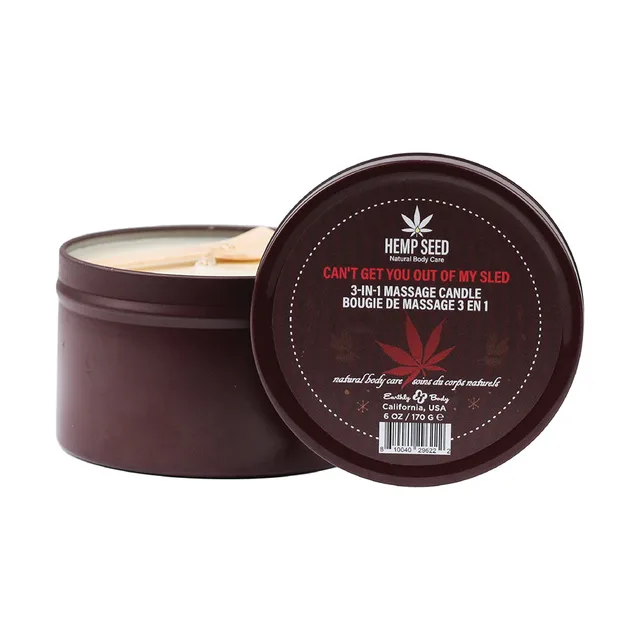 open brown Earthly Body Hemp Seed candle tin beside printed lid