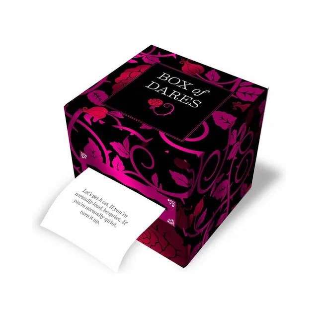black Box of Dares cube with pink scrollwork and prompt card