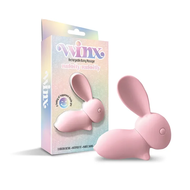 Pink WINX Babbitty Rabbitty bunny vibrator displayed beside pastel retail box