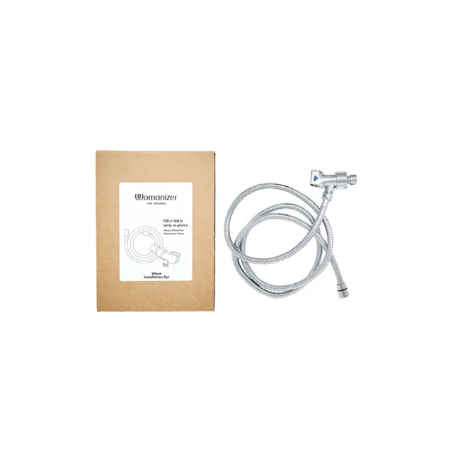 Womanizer Wave installation box beside coiled chrome hose and shower-arm adapter