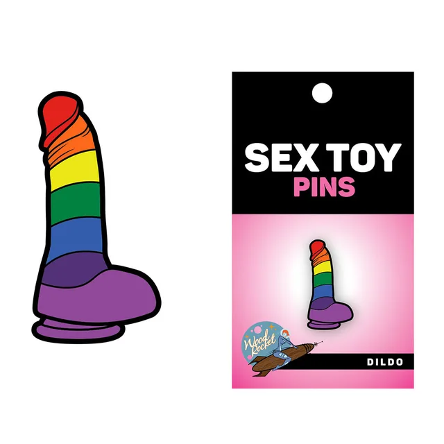 Wood Rocket rainbow dildo enamel pin beside black retail card