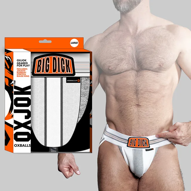 white Oxballs Oxjok Bulger jockstrap and orange-trimmed retail box beside model