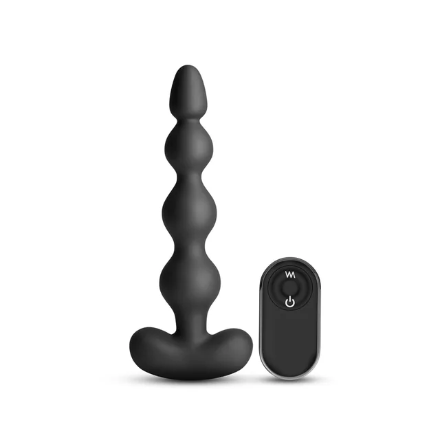 Black five-section Reign bead shaft beside oval remote
