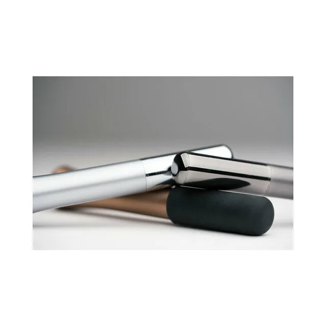 silver Crave Wink Plus opened beside its black cap and charging cable