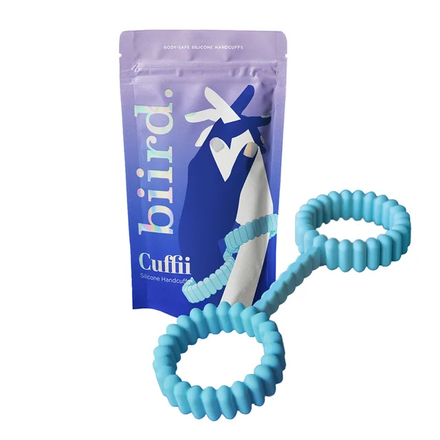 Mint Biird Biind loop cuffs displayed beside purple drawstring pouch