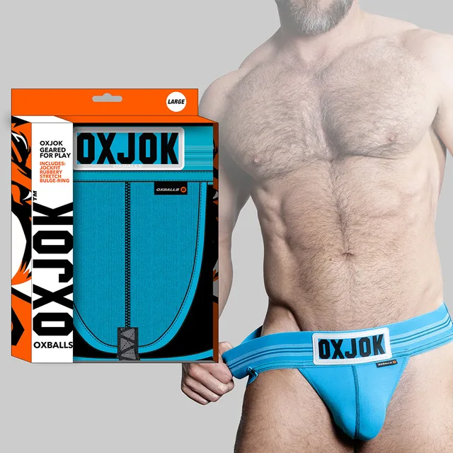 Aqua-blue Oxballs Oxjok jockstrap on model with branded retail packaging