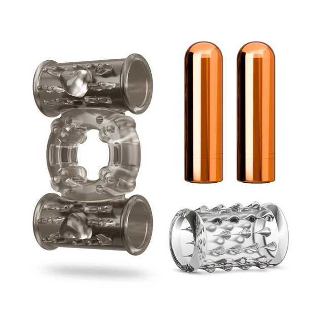 Blush Stay Hard vibrating ring set Dual Bullet components separated beside two copper-tone bullets