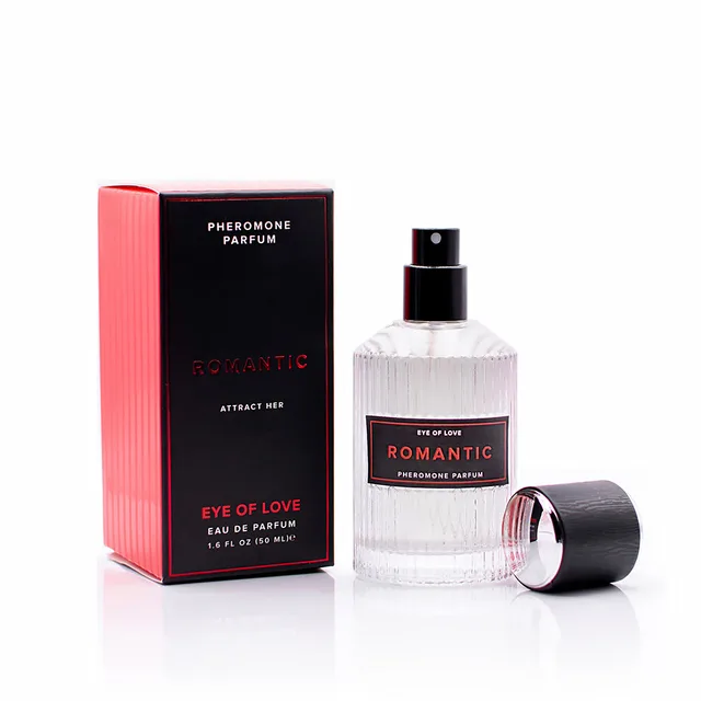 ribbed clear Romantic spray bottle with black cap beside red-black box