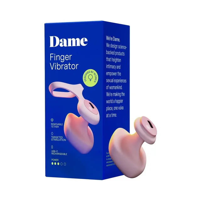 Quartz pink Dame Fin 2.0 finger vibrator beside blue retail box