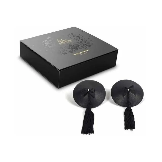 pair of round black Burlesque pasties with center bows and long tassels beside black box