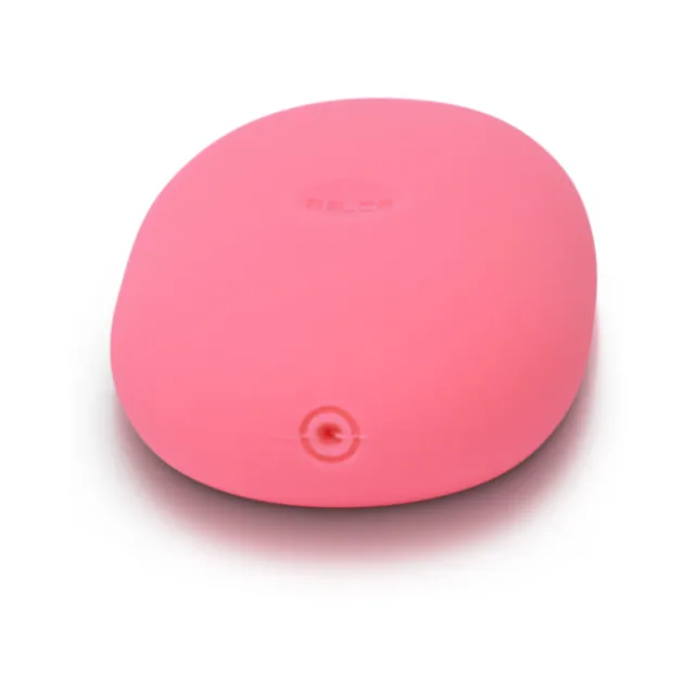 Angled top view of pink ILY Pebble showing circular control button