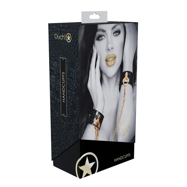 black croc-print Rome handcuffs with gold connector chain on box