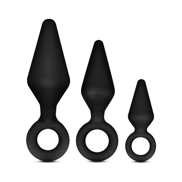 Small, medium and large black loop plugs standing together
