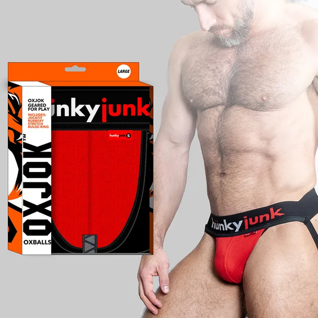 Red Oxballs Oxjok Hunker jockstrap on model with orange branded box