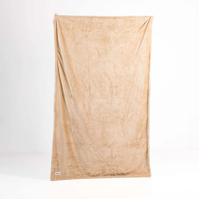 Splash Blanket Furlush medium Chai beige polyester throw hanging vertically to show the full rectangular shape