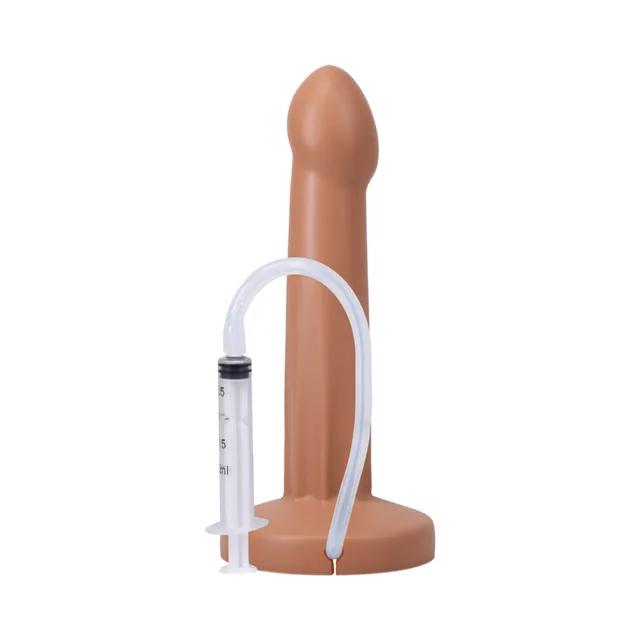 Honey POP dildo beside connected graduated syringe