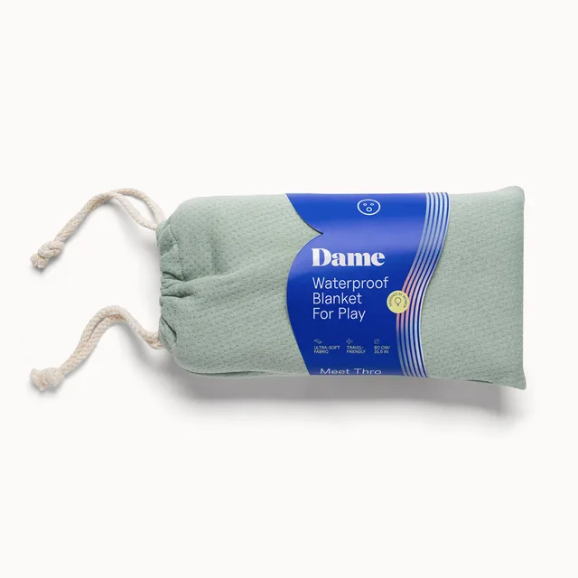 Dame Thro Sage waterproof blanket in drawstring pouch