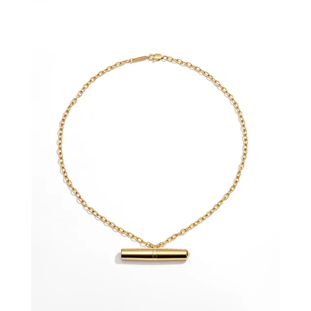 Crave Tease gold cylindrical pendant necklace vibrator full necklace with horizontal pendant centered below the chain