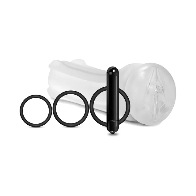 Clear pussy-opening sleeve beside black bullet and three rings