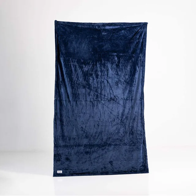 Splash Blanket Furlush large navy blanket hanging full length on white