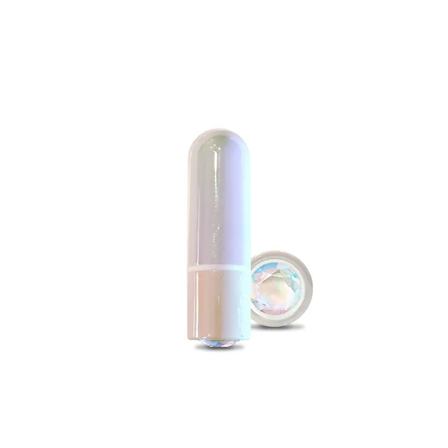 WINX Sugar Cookie rounded bullet vibrator standing beside gemstone-style base