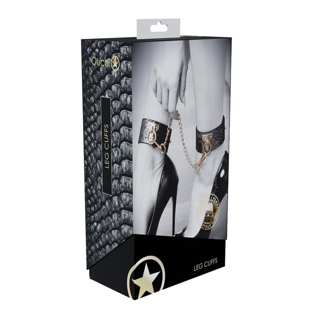 black and silver snakeskin Florence leg cuffs with gold chain on box