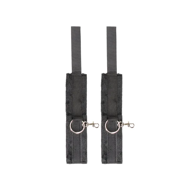Pair of black hand cuffs laid flat with metal snap hooks