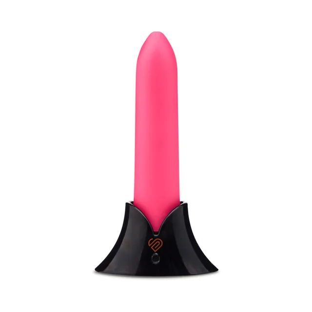 upright pink Nu Sensuelle Point vibrator seated in its black charging base