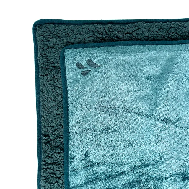 Splash Blanket The OG small emerald-green blanket corner close-up with textured reverse