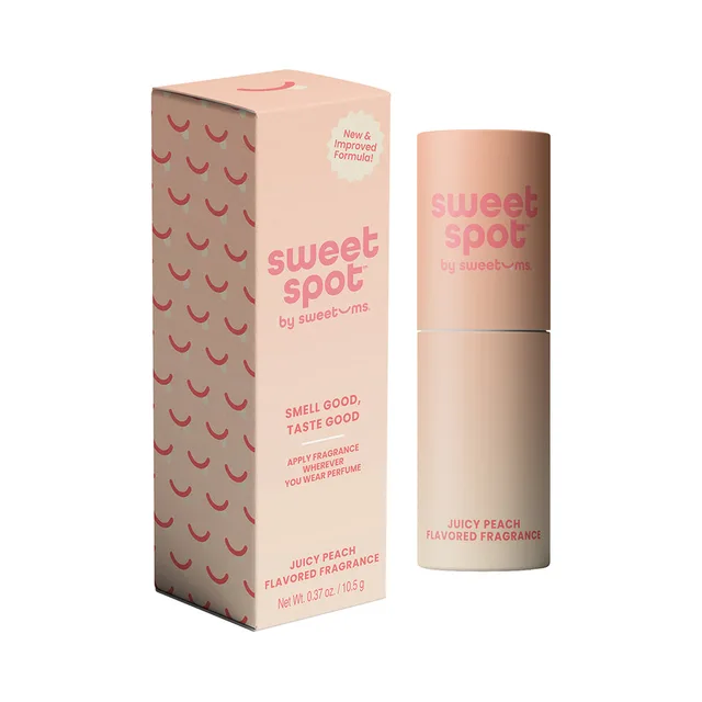 Sweet Spot Juicy Peach fragrance stick beside peach-pink patterned box