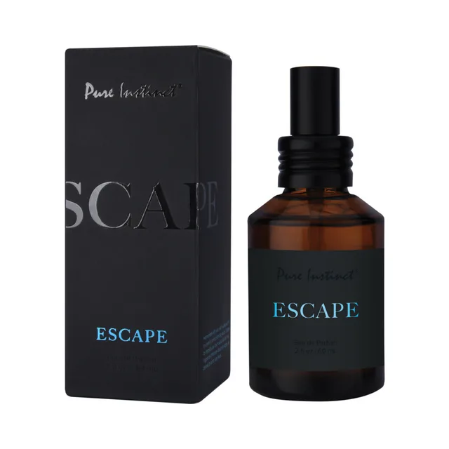 Pure Instinct Escape amber perfume spray bottle beside black box