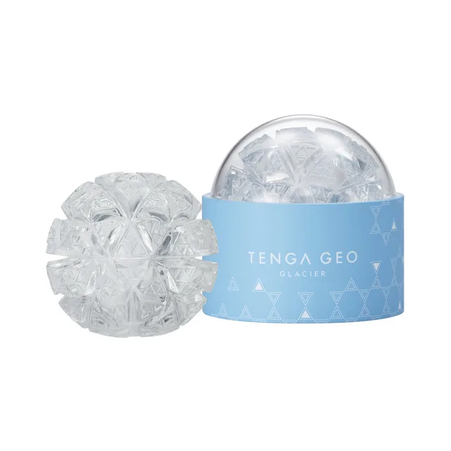 TENGA GEO Glacier clear stroker clear faceted sphere beside the pale blue storage base