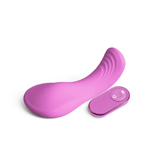 Pink curved Grinders Rocker beside matching remote