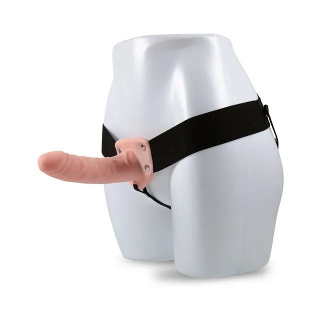 Beige Dr. Skin 6-inch hollow strap-on mounted on mannequin with black harness