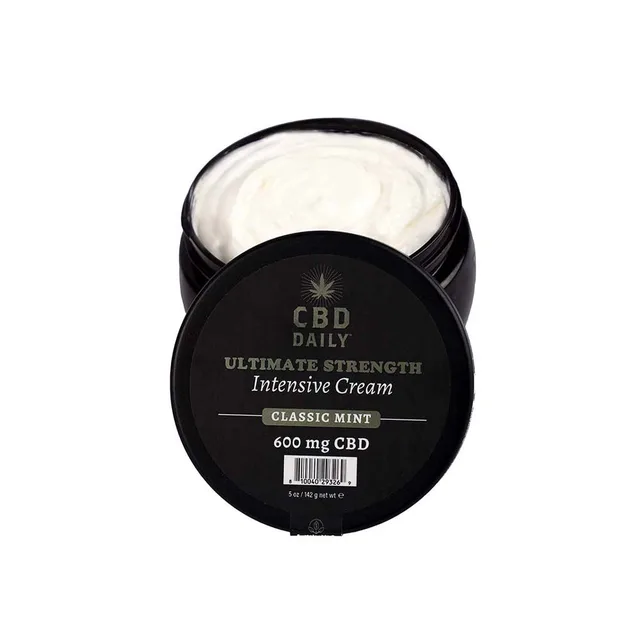 Open black jar of white CBD Daily Classic Mint cream beside lid