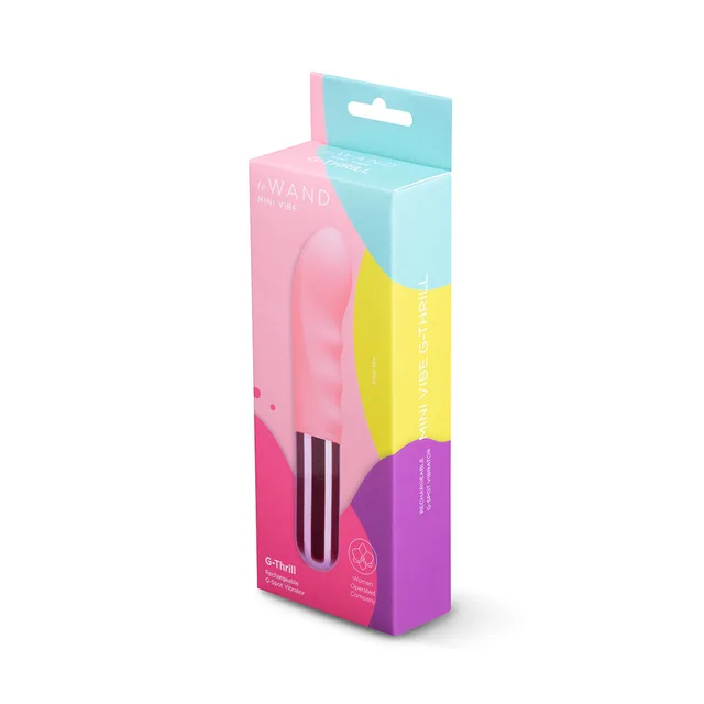 Light pink Le Wand G-Thrill beside pink-and-teal retail box