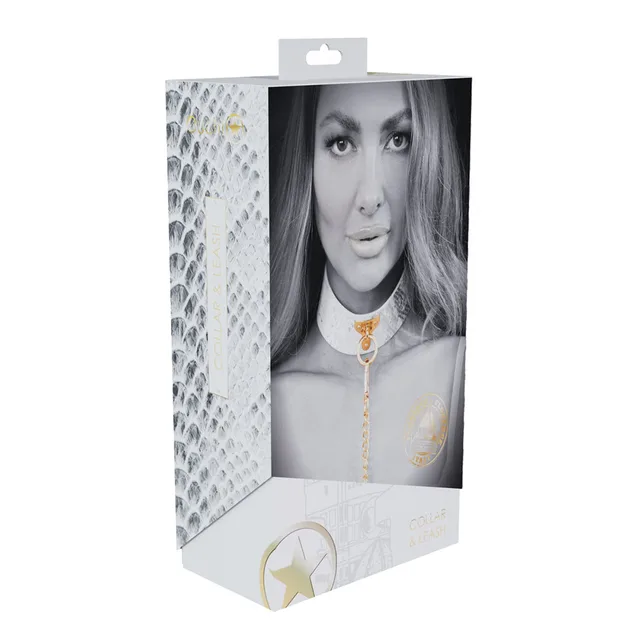 white and silver snakeskin Florence collar with gold chain leash on box